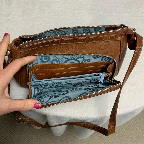 Brighton tan purse with blue patterned interior.  Built in wallet - Picture 6 of 10